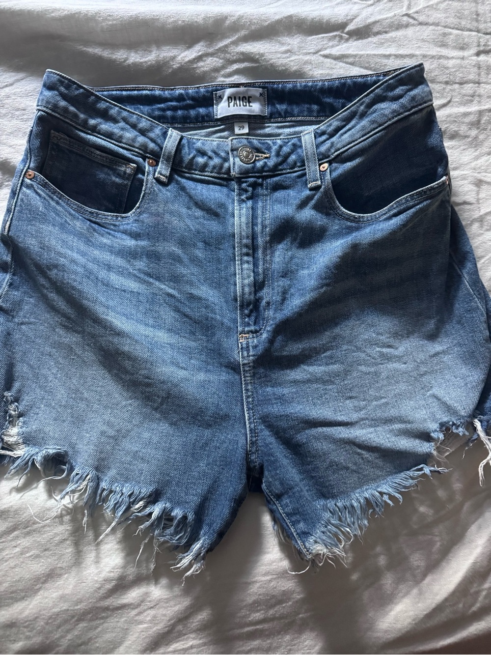 PAIGE Dani Light Blue High-Rise Distressed Denim Shorts